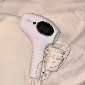 White Ergonomic Handheld Device with Coiled Cord
